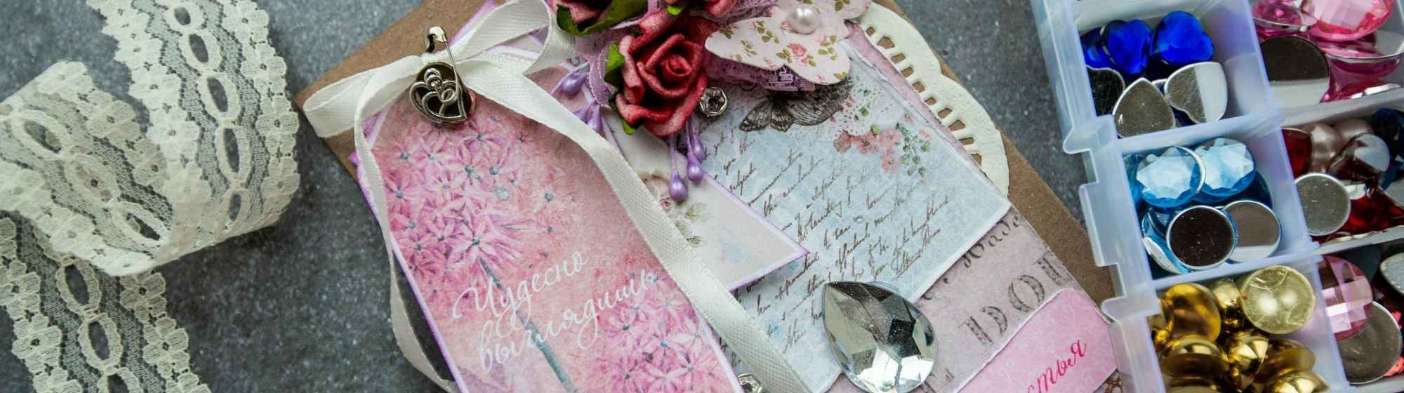 A scrapbooking layout featuring patterned paper, flowers, ribbons and craft accessories.