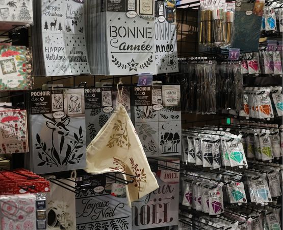 A section dedicated to scrapbooking supplies, including stencils, stickers and craft accessories.