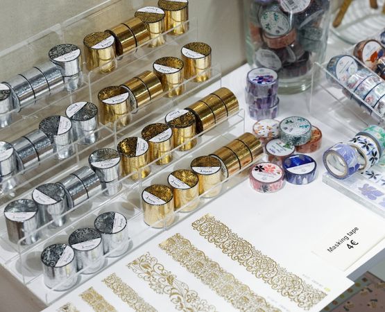 A collection of masking tape and decorative accessories for scrapbooking and DIY.