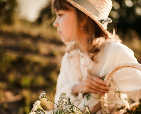child country outfit with hat, basket and flowers outdoor nature wedding atmosphere