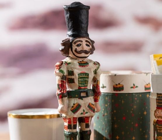 Felt Christmas decorations including a gingerbread man, a Christmas tree and other festive objects.