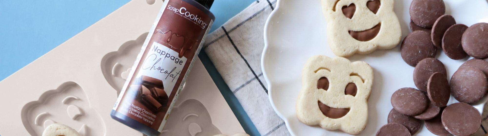 Smiley-face biscuits made using silicone moulds and chocolate chips.