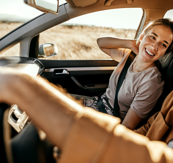 Woman laughing in a car