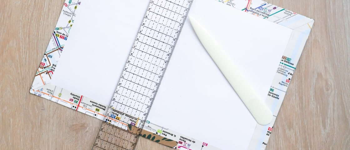 DIY handmade travel journal materials: folding with a folding knife and a ruler