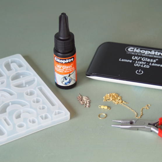 Materials needed to make a necklace with a resin pendant