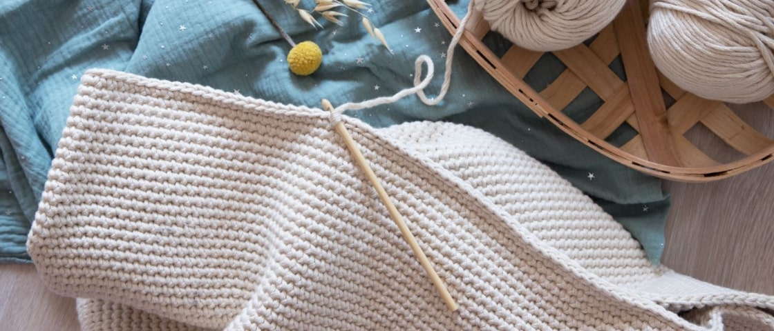 Crochet creation with a ball of white wool