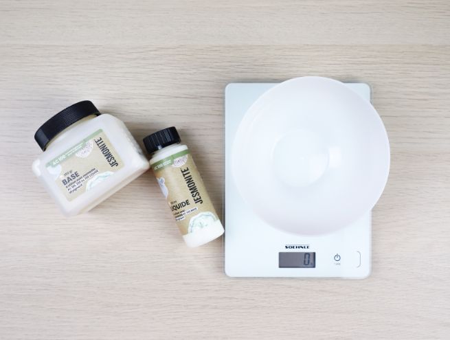 Jesmonite ingredients placed next to an electronic scale with bowl.
