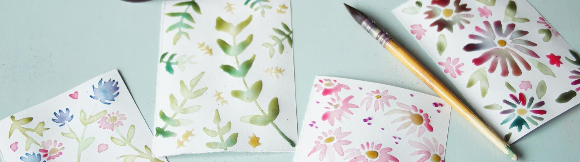 Floral cards painted with vegetable ink using pots of natural ink made from red cabbage, beetroot and dates.
