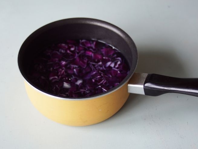Red cabbage simmering in a pan to extract its colour.