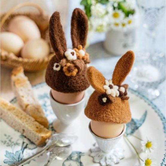 Carded wool egg warmers in the shape of a bunny personalised for Easter