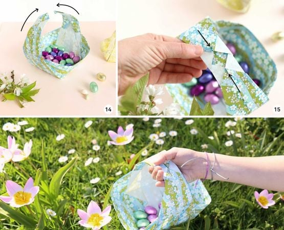 Panier en origami rempli d’œufs posé dans l’herbe parmi des fleurs printanières.